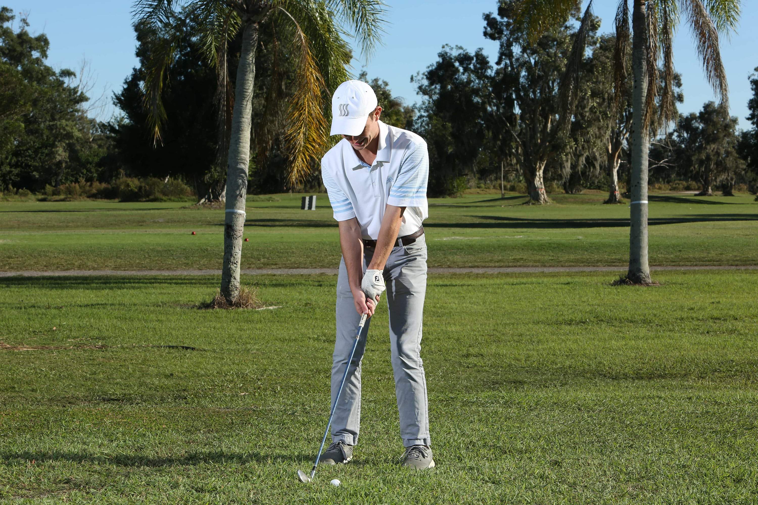Golfer wearing our moisture wicking hat to help keep the sweat off his face and out of his eyes. Our golfing hat helps keep you at the top of your by eliminating sweat and the sun.