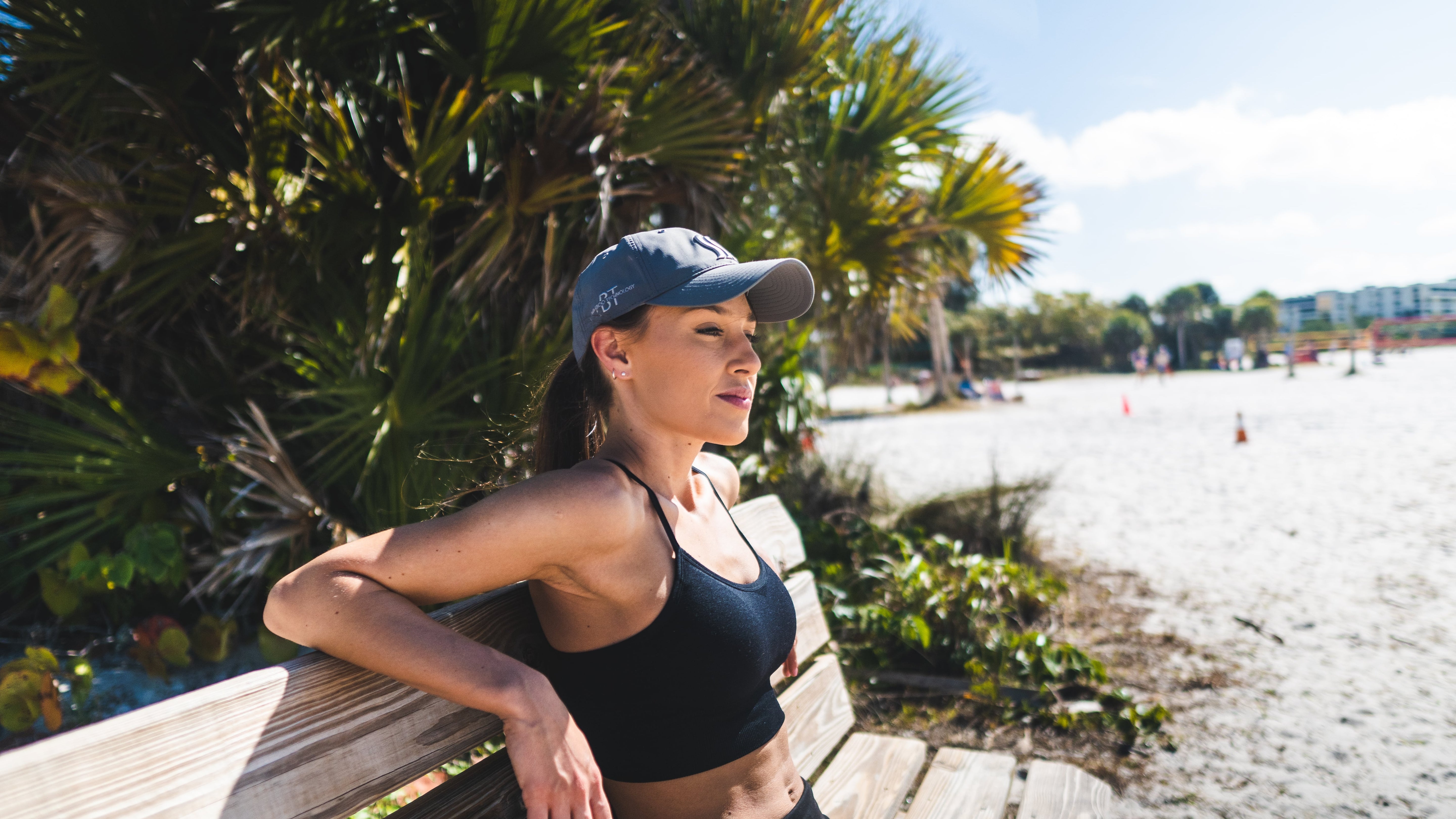 Women casually wearing a sweat wicking hat because she loves activewear and athleisure outfits.