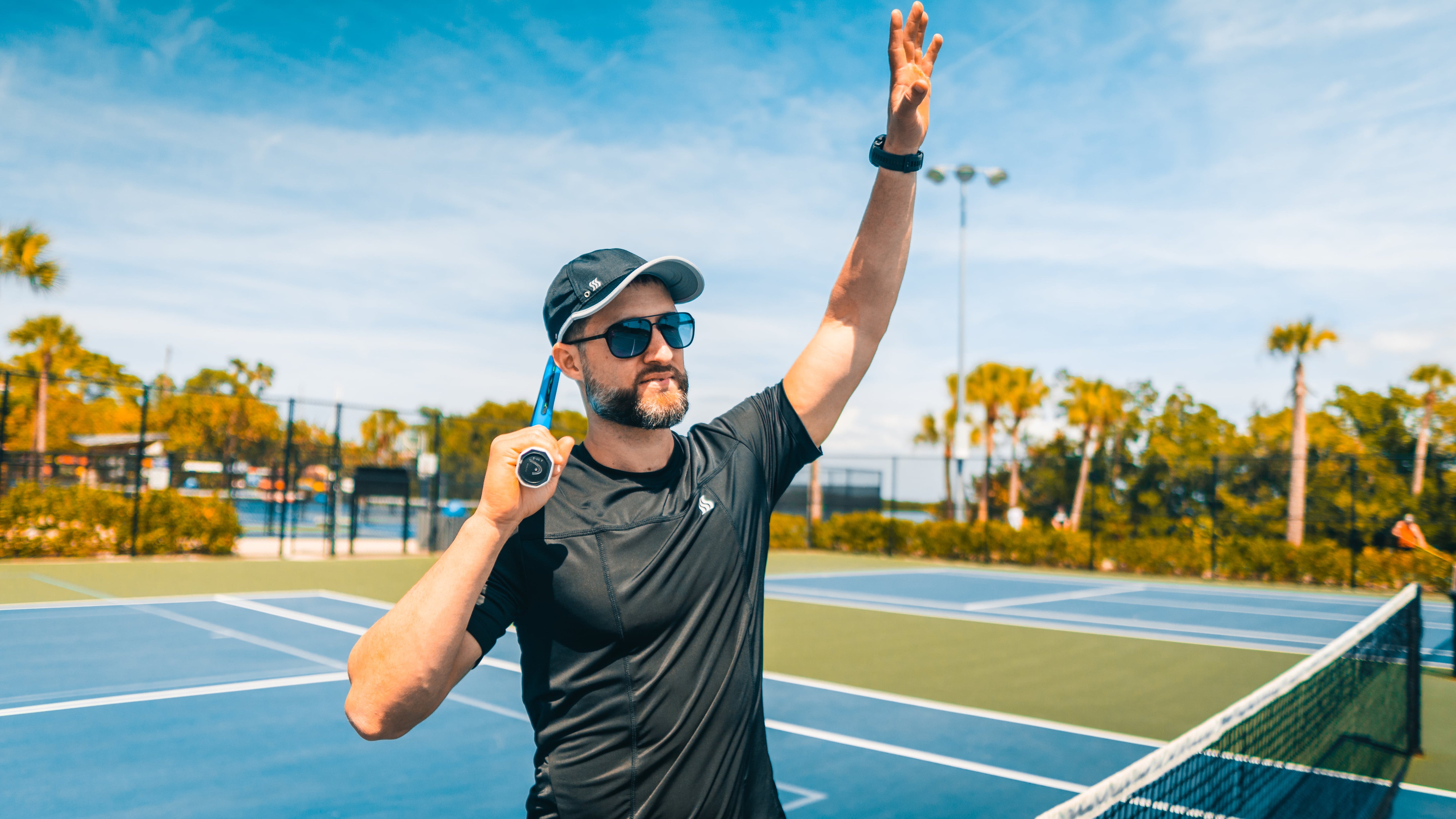 Tennis player wearing a SAAKA sweat wicking hat that helps block the sun and sweat. No more headaches or stiffness with our super soft and comfortable design.