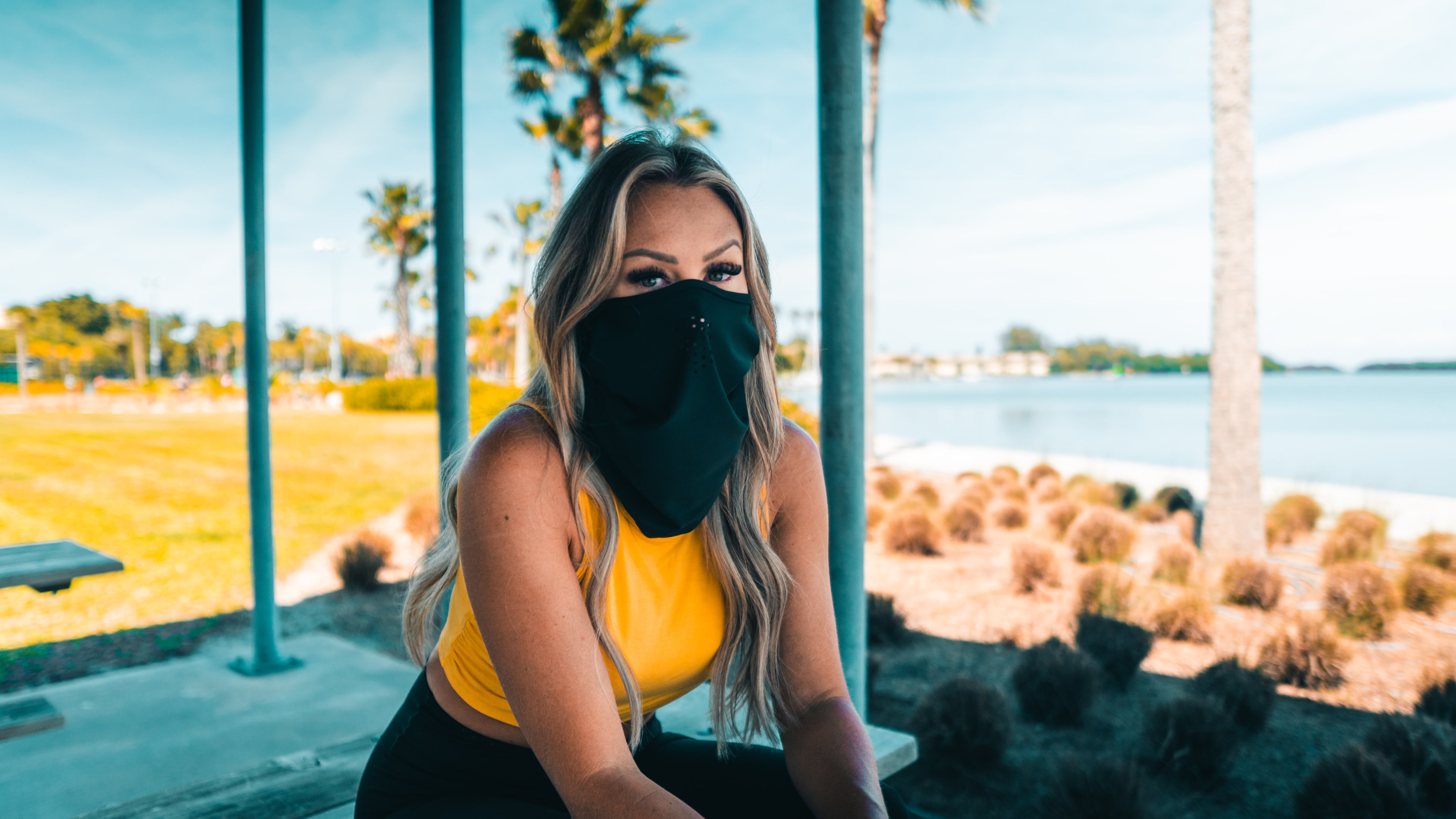 Women wearing a headband and neck gaiter to protect herself from the sun while enjoying the outdoors.