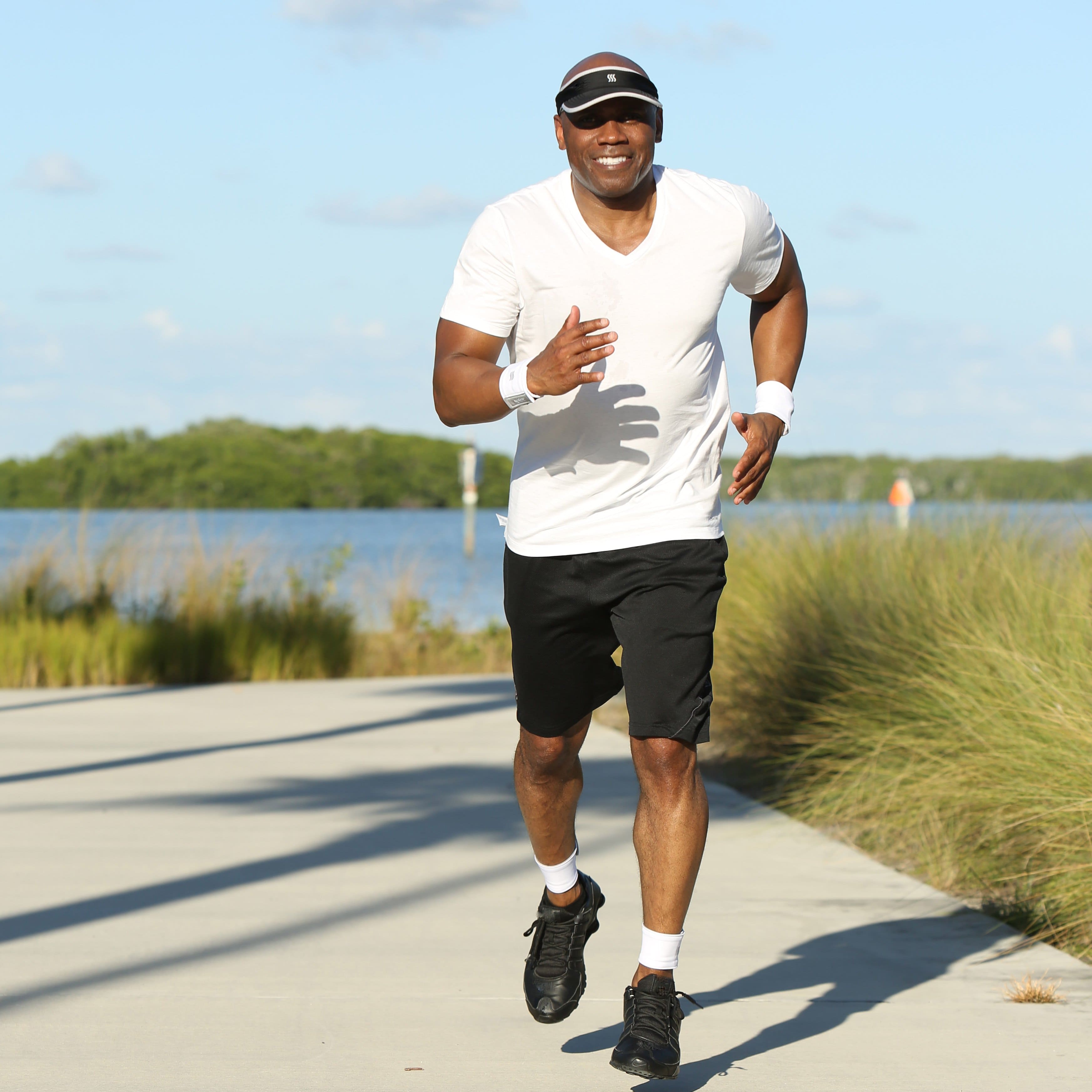 Man running enjoying his pair of sweatband wristbands.