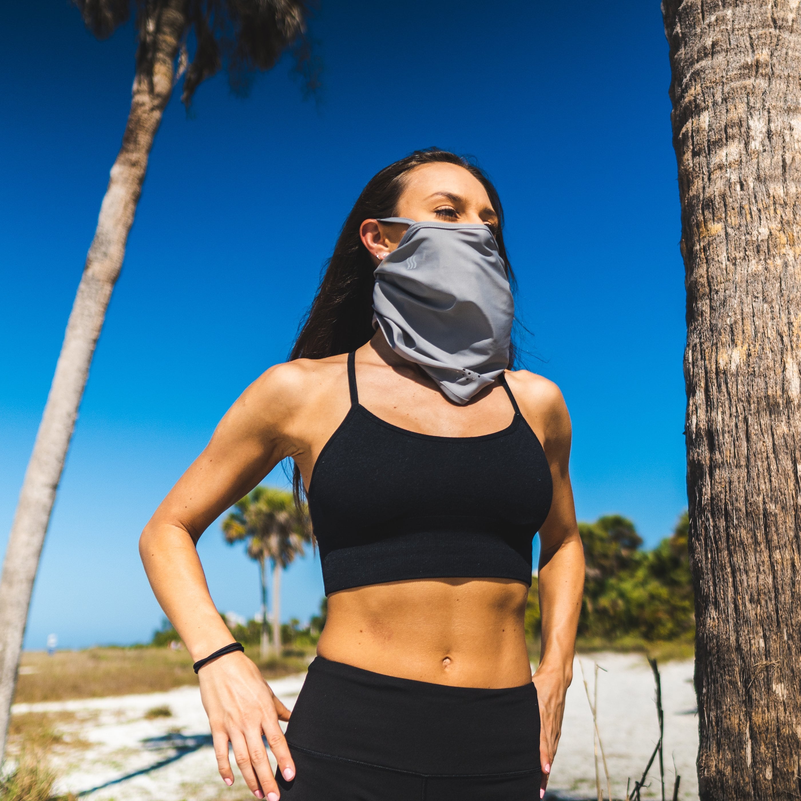 Women wearing our headband as a face mask and neck gaiter while enjoying the outdoors.