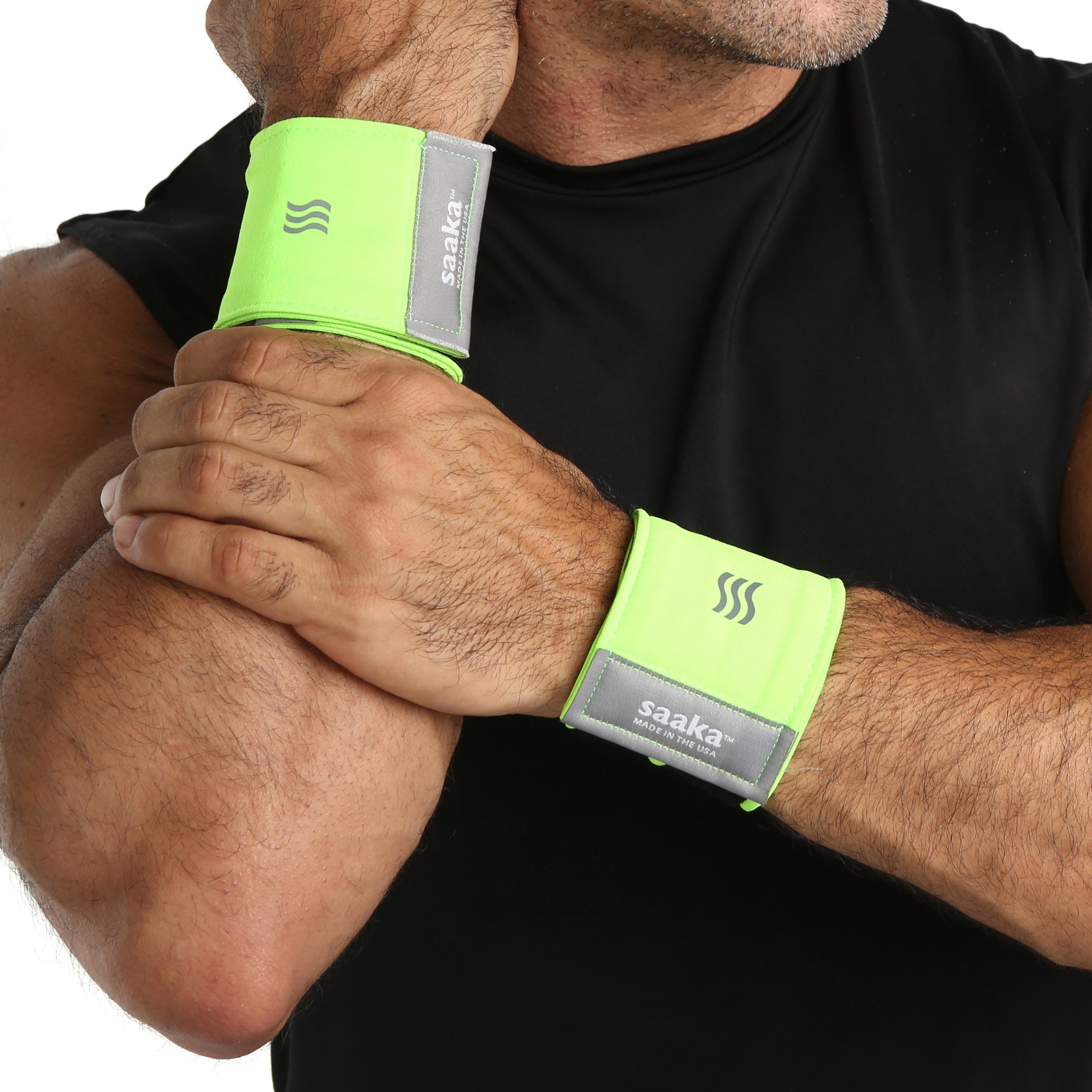 Man wearing athletic wrist sweatbands in neon green.