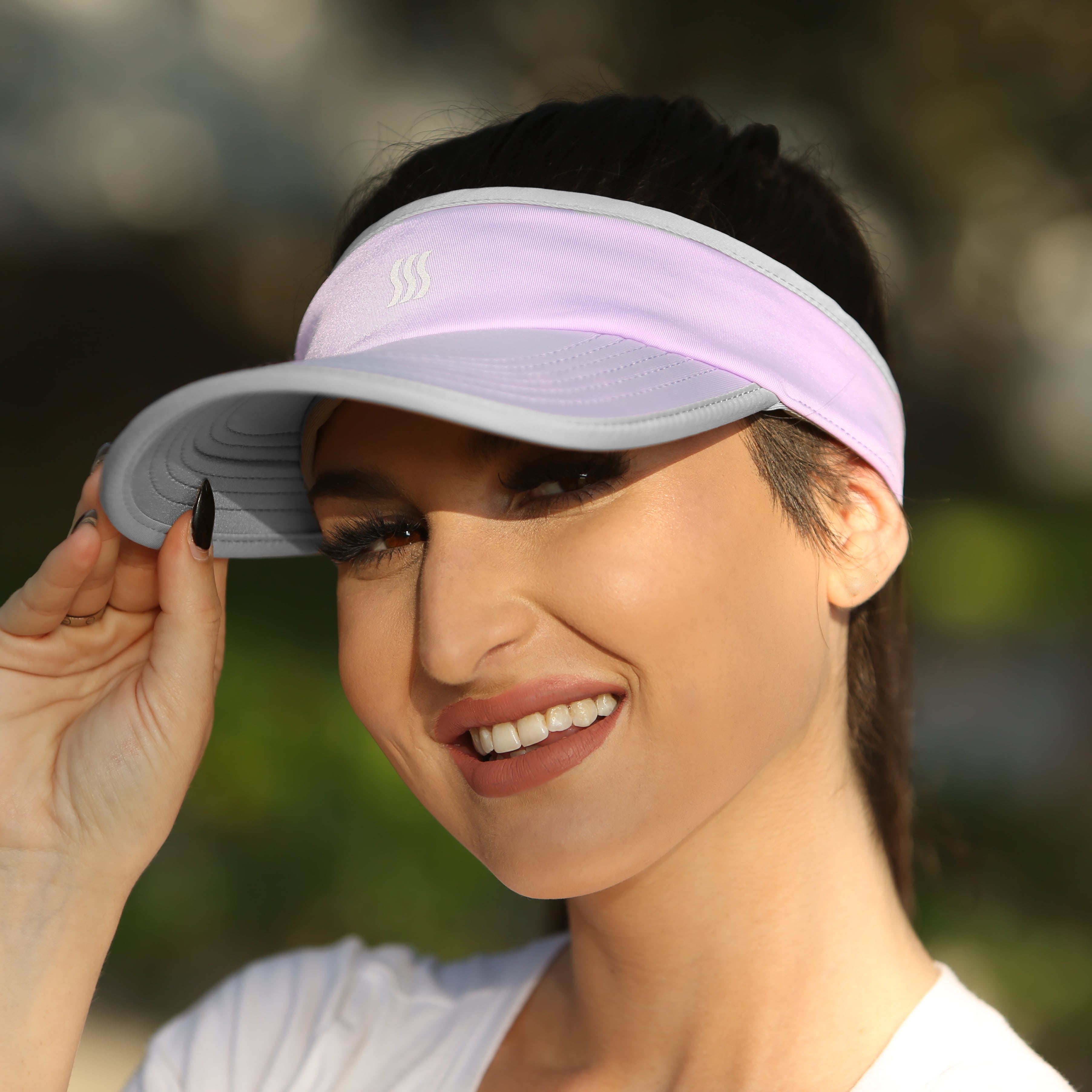 Women wearing a visor while walking.