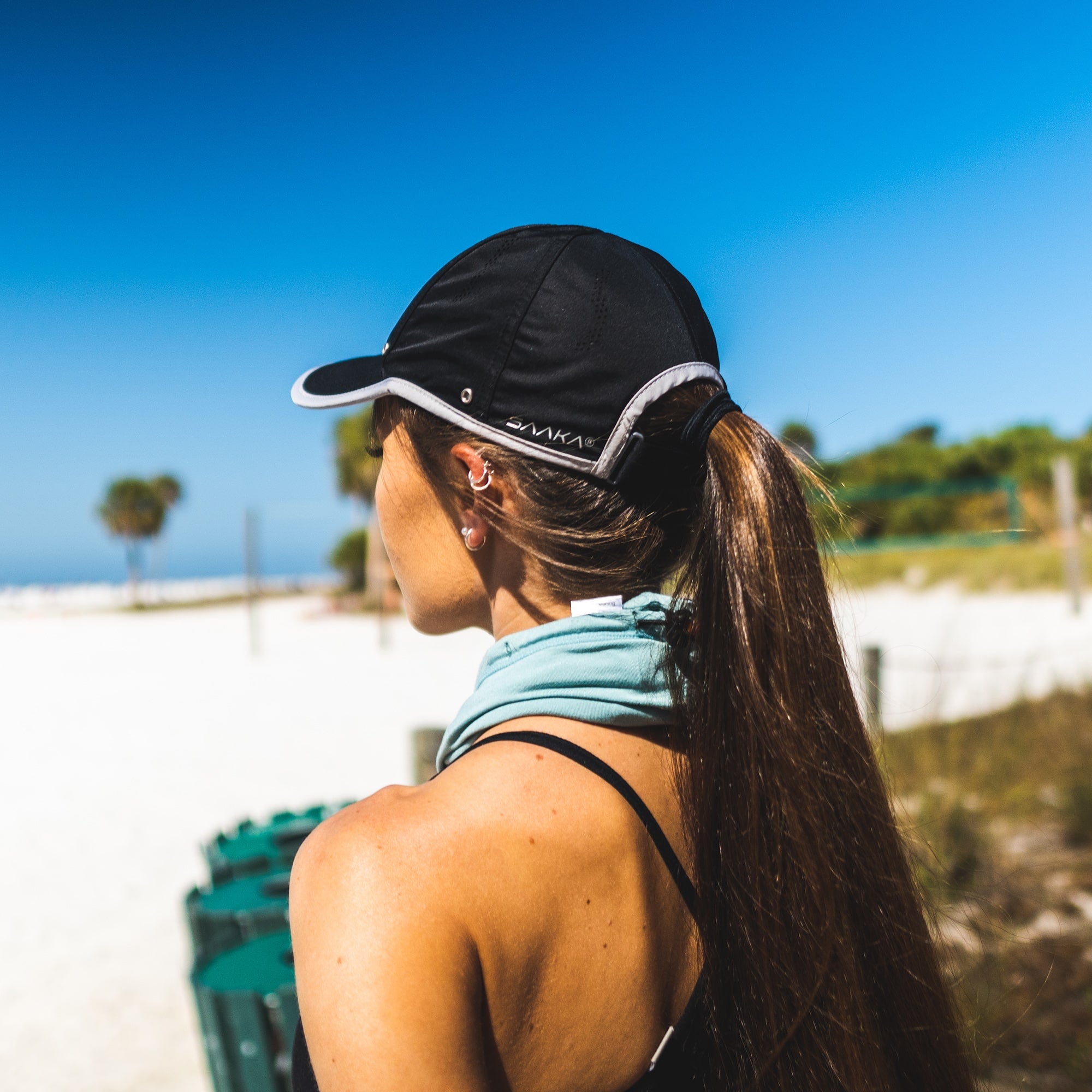 Women wearing a black hat on the beach