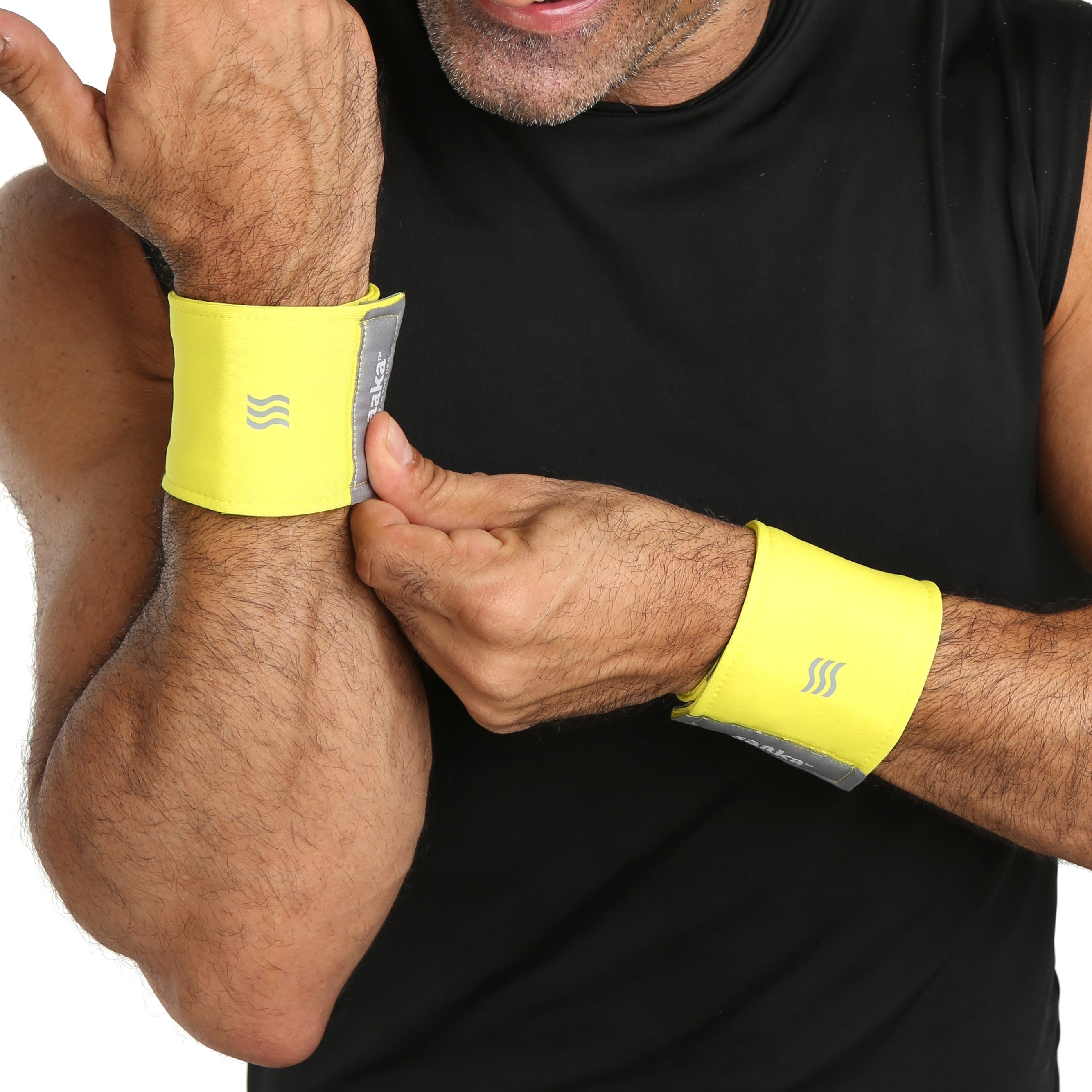 Man wearing yellow wristbands for sweat.
